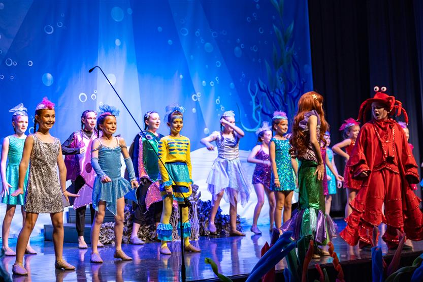 Students perform onstage